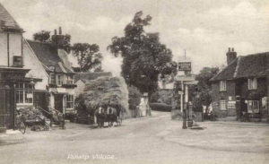 Ruislip Village Postcard - looking towards Sharps Lane from the mini-roundabout. That’s Prezzo on the right.
